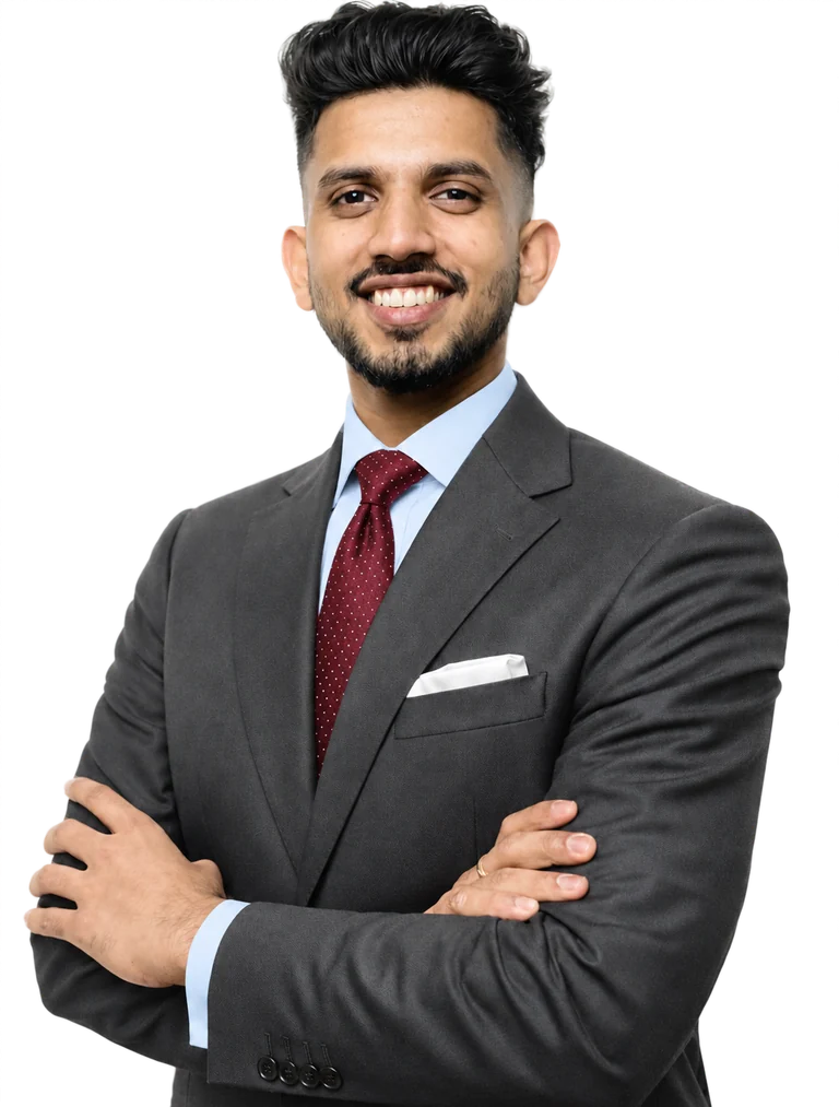 G Mon, smiling, in a charcoal suit and burgundy tie